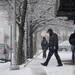 A man shovels the sidewalk in front of several businesses along W. Washington near S. State street on Tuesday morning.  Melanie Maxwell I AnnArbor.com